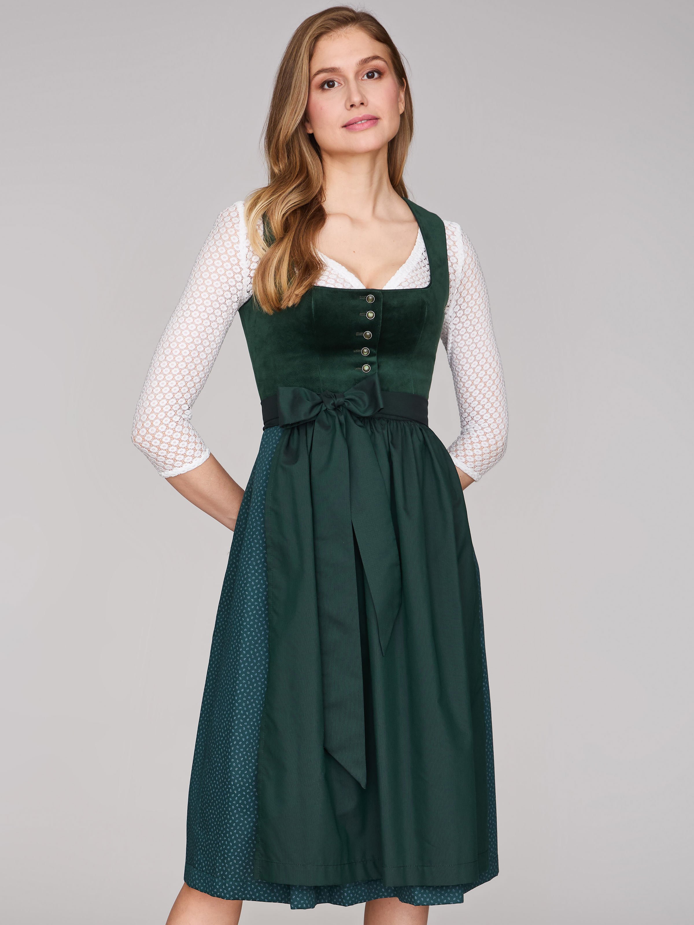 Dunkelgrünes Samt-Dirndl mit Knöpfen