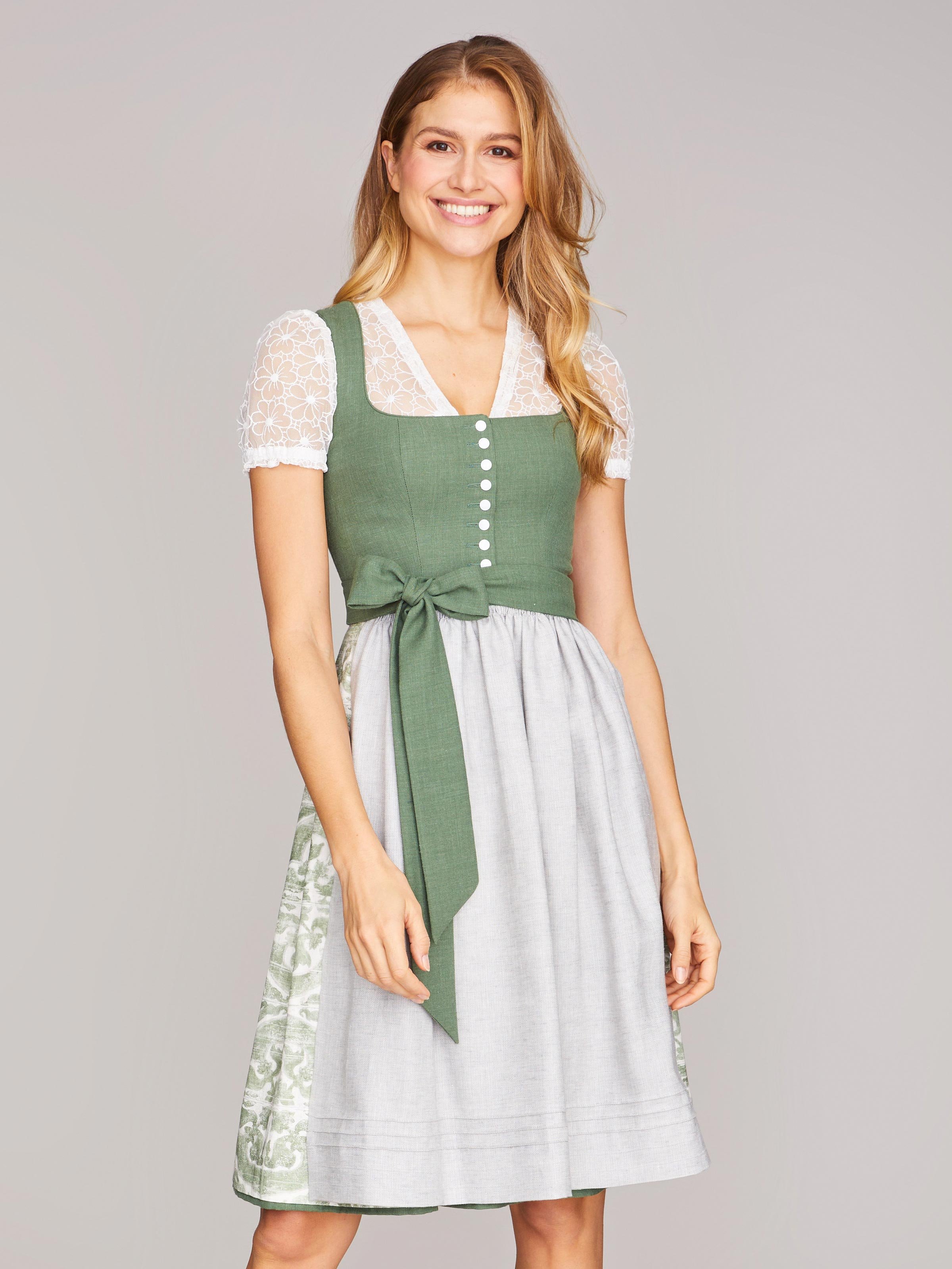 Grünes Dirndl mit Knöpfen